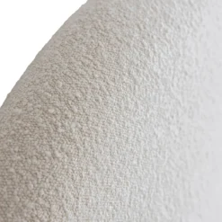 Lit tissu beige avec tête de lit bouclette